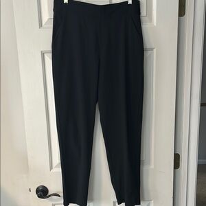 Athleta black city trousers with tapered leg and elastic waste size 10.